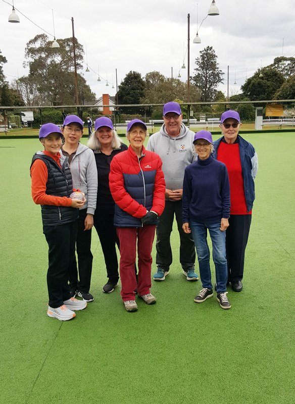 The latest group of bowls 'alumni' posed for a photo wearing caps in Club colours