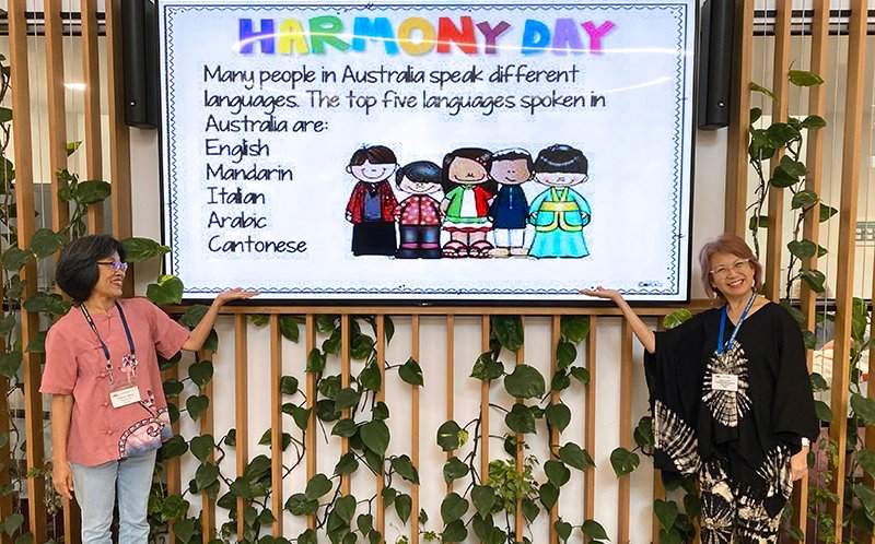 Pauline Wang (Treasurer) and Paulina Chong (Committee member) highlight Harmony Day at the Hub 2023
