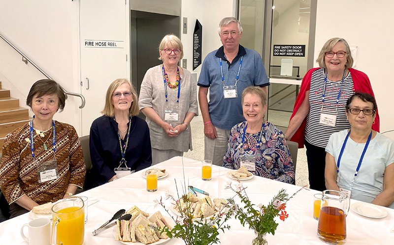 President Gary Walker lunching with some of the Front Desk Volunteers